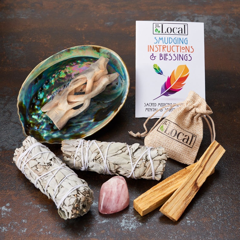 Sage smudge kit with white sage bundles, palo santo sticks, abalone shell and rose quartz